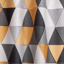 Vesta-Okkersárga színű nyomott háromszögmintás dimout egyedi méretre varrva