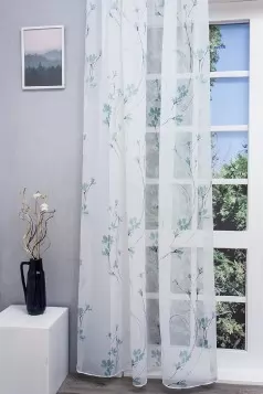 Cintia - Nyomott türkiz virágmintás voile függöny egyedi méretre varrva